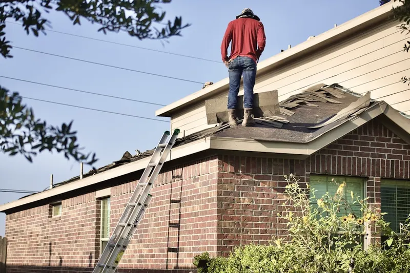 Professional roofer working on a residential roof in The Anaheim Resort